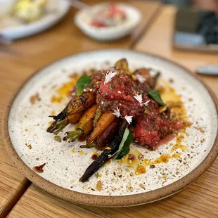 Carrots in a strawberry chili sauce. Super new flavor combination. Not our favorite dish but we really loved the creativity!