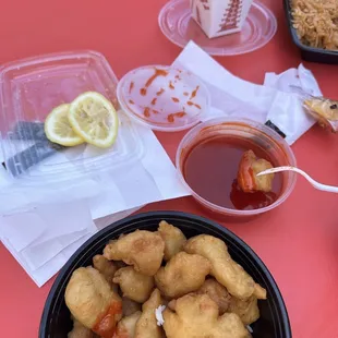 a bowl of fried food and a cup of tea