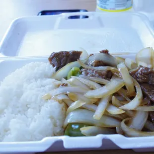 a styrofoam container of food