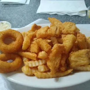 Fish and chips with round hush puppies.