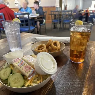 Salad, hush puppies, water and sweet tea.