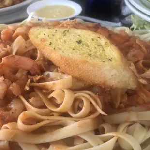 a plate of pasta and bread