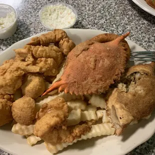 Fried scallops, jumbo shrimp, crab with coleslaw, hush puppies, French fries