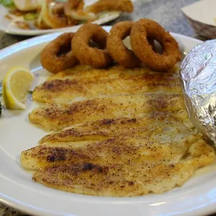 Broiled catfish with hushpuppies and a baked potato