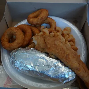 trout+popcorn shrimp (I&apos;ve already eaten most of it) and hush puppies + baked potato sides