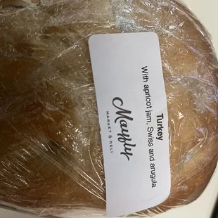 a loaf of bread wrapped in plastic