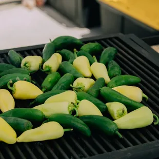 green peppers on a grill