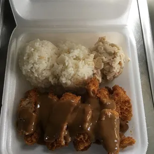 a meal in a styrofoam container
