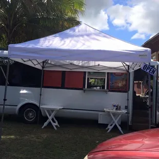 a food truck parked in front of a house