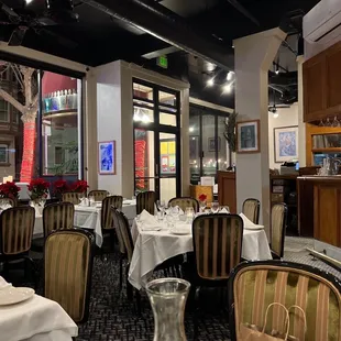 a dining room with tables and chairs