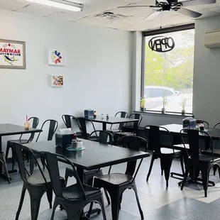 a dining room with tables and chairs
