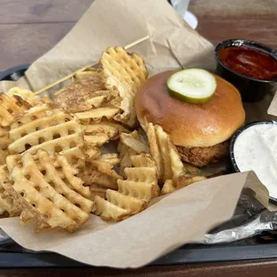 Crispy Chicken Sandwich with a side of Nashville Hot Sauce