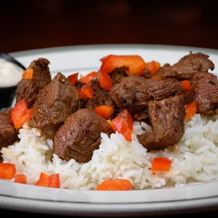 a plate of beef and rice