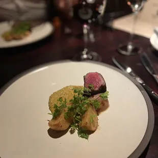 Top sirloin and roasted potatoes with a chimichurri (I think) sauce. The best sirloin I've ever had!