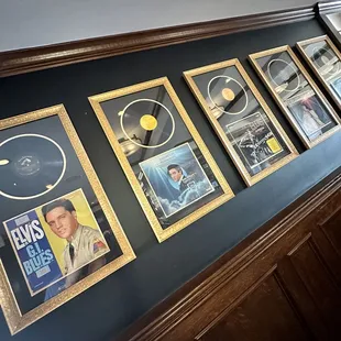 a row of framed memorabilias