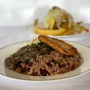 Carne asada entree with gallo pinto and queso frito.