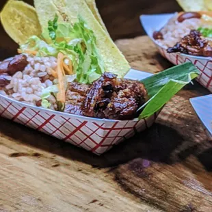 three baskets of food on a wooden table