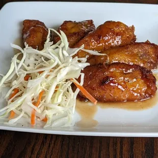Maduros is another one of our side dishes. Served here with cabbage salad.