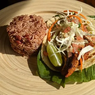 Cerdo asado is one of our entrees. Served here with gallo pinto, tortilla and cabbage salad. Very delicious!