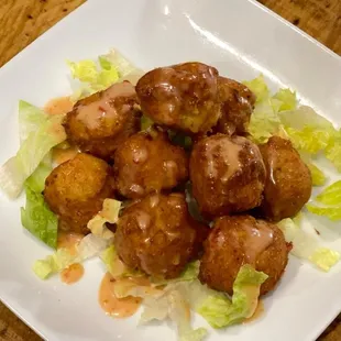 These shrimp stuffed buñuelos are delicious and food addictive, the thai chili mayokechu sauce went great with them.