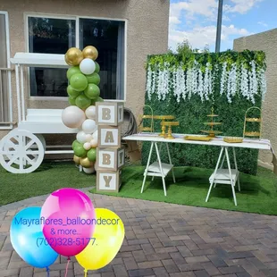 Greenery backdrop set up all done by us! 
We add the dessert trays/stands, BABY blocks and balloons