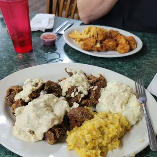 Huge order of chicken livers w corn pudding and mashed potatoes,  my fork is for size reference.