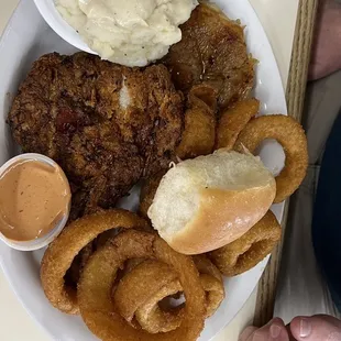 Pork chops - one fried and one grilled, onion rings