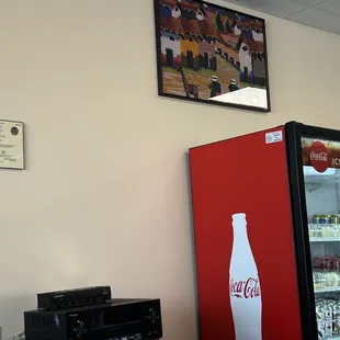 Cold case offering brewed drinks, sodas, fresh desserts.