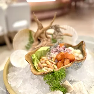 a clam shell filled with seafood