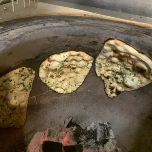 NAAN and GARLIC NAAN:  can not beat the freshness.  Prepared fresh at the time of your order.