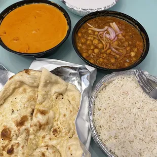 Garlic naan, butter chicken, and chana masala