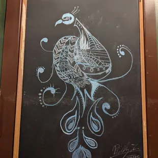 Beautiful original drawing on the wall of exposed brick.