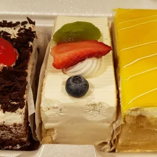 Eggless cakes by the slice - black forest, fresh mixed fruit (best one!), and mango.