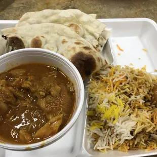 Spicy Achari chicken with a side of veg Biryani rice and fresh naan bread right out of the clay oven...$8 well spent!