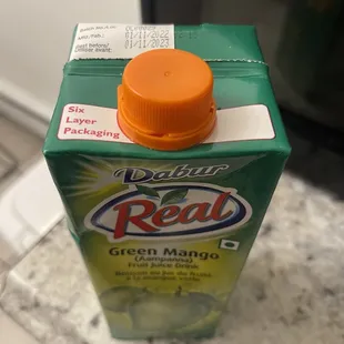 a carton of real green mango juice