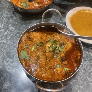 a pan of chicken curry