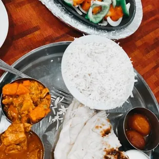 Thaali (kind of like a curry sampler) on the bottom, Shrimp Tandoori on the top. Both delicious!