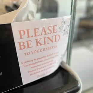 Sign asking for kindness to the baristas.