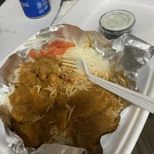 Butter chicken. On a bed of rice and I&apos;m not sure if the onions and tomatoes were considered to be a salad.