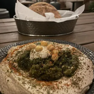 Hummus with schug and pita bread