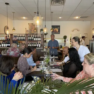 a group of people sitting around a table
