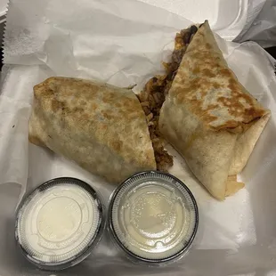 Burrito wrap La brava (ground beef, pineapple, chorizo) with black beans &amp; rice inside- free side of sour cream &amp; melted queso sauce