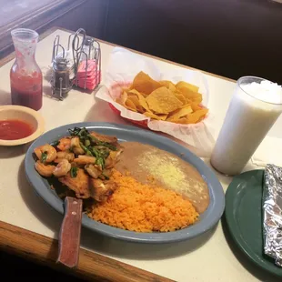 Delicious fish and shrimp with beans and rice