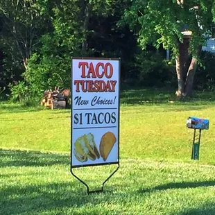 a taco tuesday sign in a field