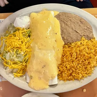 Beef and Chicken Fajita Burrito served with Beans and Rice! Wonderful!