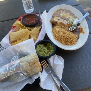Steak enchiladas, beef, tongue, burrito, guacamole, chips, and good times