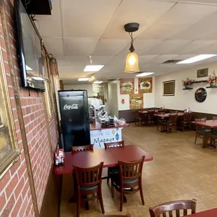 an empty restaurant with tables and chairs