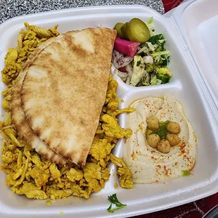 a meal in a styrofoam container