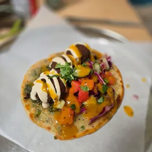 Falafel on an onion pita with salsa. Delicious!