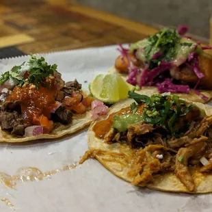 two tacos with meat and vegetables